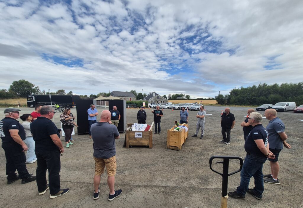An image of Team Ireland briefing before training for the World Professional Driver Championships